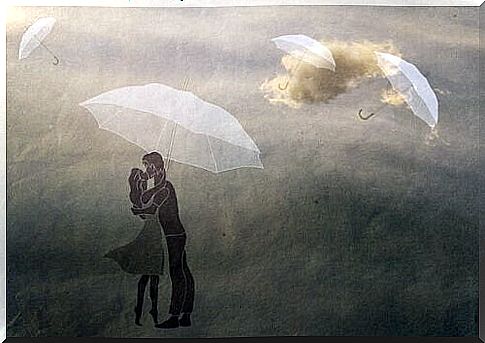 couple and flying umbrellas