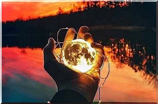 glowing globe in human hand