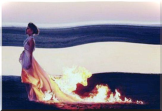 the woman's dress is on fire