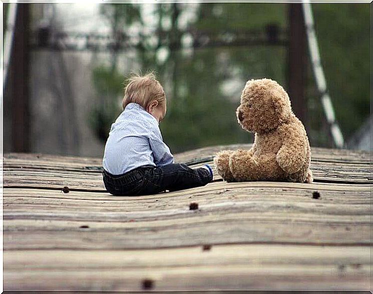 little boy and big teddy bear