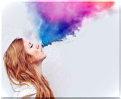 woman blowing colors