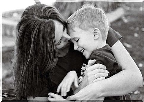 mother kissing her son