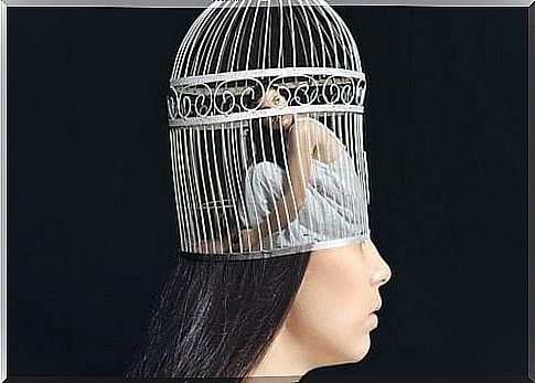 The woman's head is in a cage