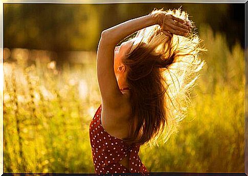 woman happy in a grain field