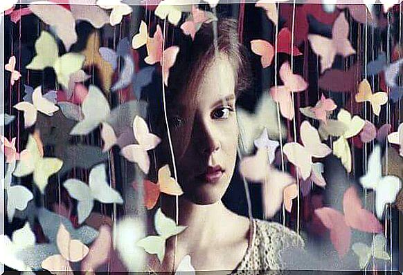 Girl and paper butterflies